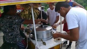 'Eating Puso And Siomai On Street Food Cart In Cebu'