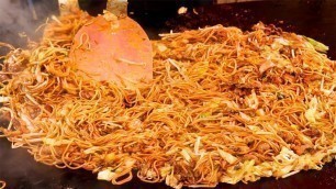 'Japanese Street Food - YAKISOBA Omelette Stir Fried Noodle with egg Kuromon Osaka Japan'