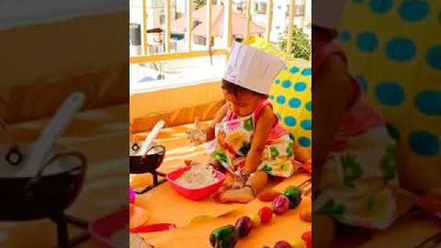 'cute little girl cooking food'