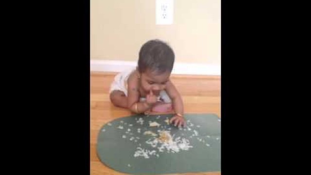 'Cute baby 6 month old baby eating lunch.      1st Onam Sadhya'