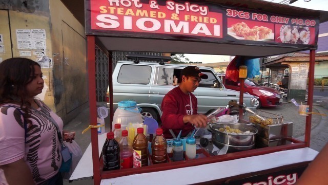 'Philippines, street food, buying Siomai outside SM City San Jose Del Monte'