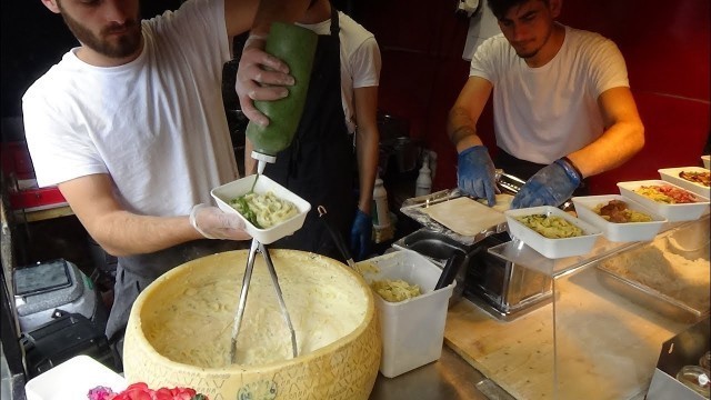 'Italian Street Food: Hand Rolled Pasta Fettuccine Alfredo by Cheese Wheel, Camden Lock Market London'