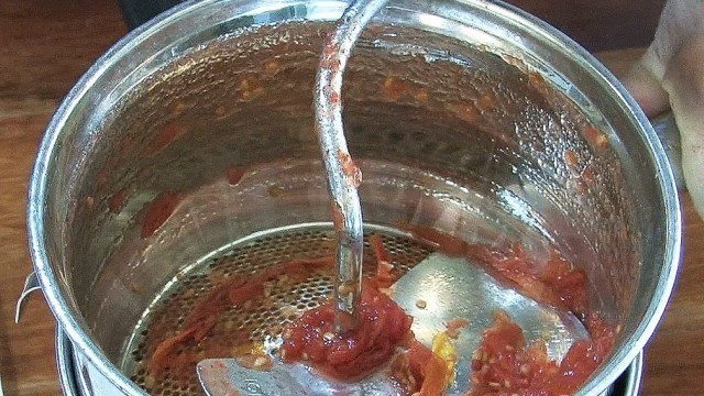 'Using the Foley Mill To Strain Tomatoes'