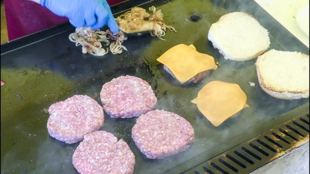 'Cooking Hamburgers of Chianina Cow Beef. Italian Street Food'